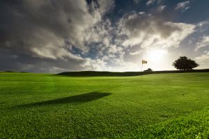 Golfing green with sunset at Holywell Bay Golf, near Newquay