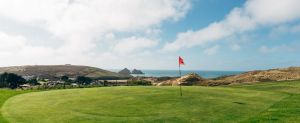 Golf green with view of Gull Rocks at Holywell Bay Golf